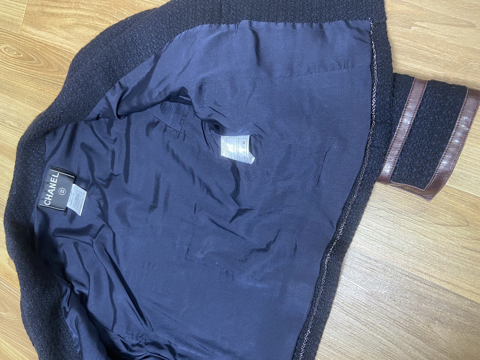 40 Chanel logo buckle leather trimmed wool tweed jacket