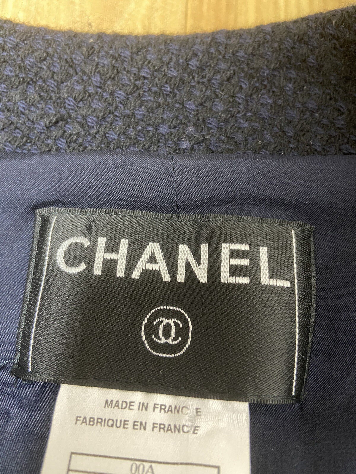 40 Chanel logo buckle leather trimmed wool tweed jacket