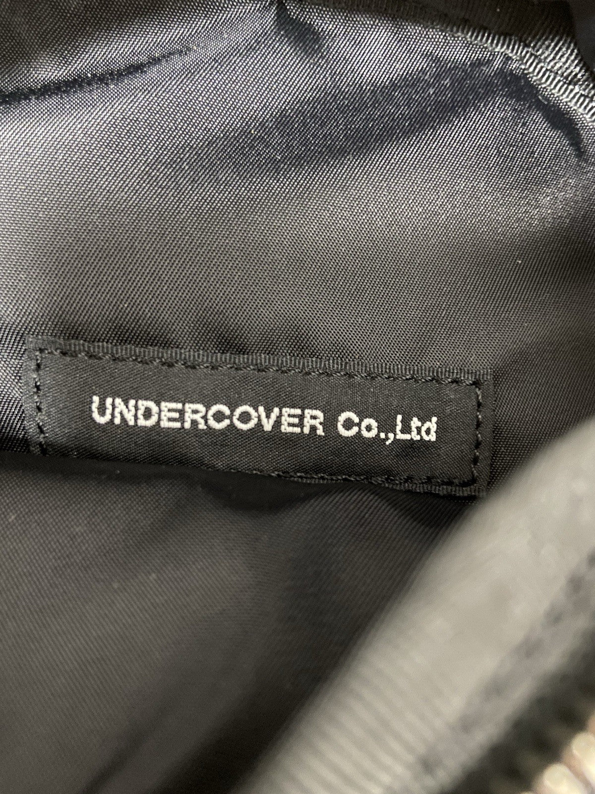 Os Undercover Leather SPIKE studded mini backpack